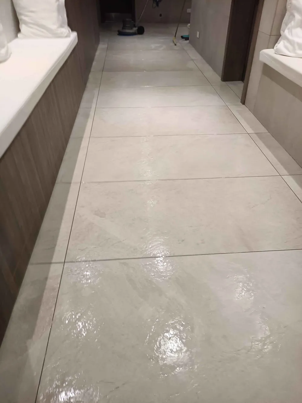 Wet hotel corridor floor being slip tested in Malta